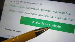 Żółty długopis i napis "Umów się na e-wizytę"